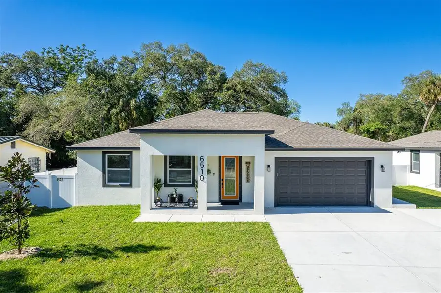 Front exterior of a new home in , Tampa, FL, highlighting curb appeal (Image 1). Front exterior of a new home in , Tampa, FL, highlighting curb appeal (Image 1).