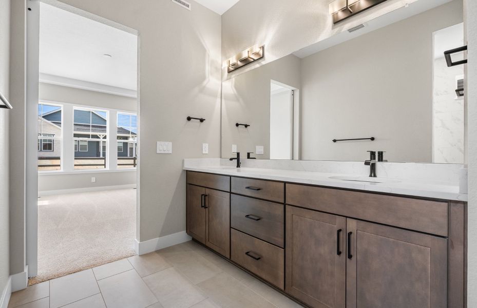 Furnished interior view inside a new home in Hilltop at Inspiration, Aurora (Image 17).