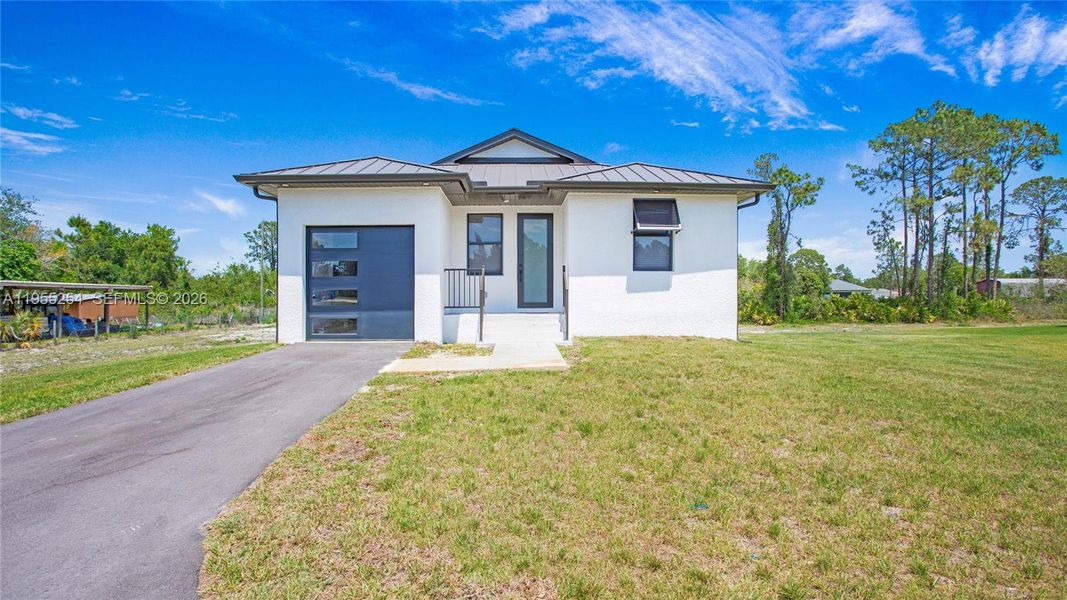 Front exterior of a new home in , Naples, FL, highlighting curb appeal (Image 31).