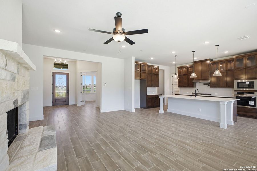 Furnished interior view inside a new home in Pradera Ridge, Floresville (Image 1).