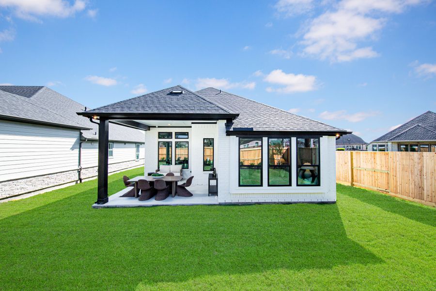 Exterior details and patio area of a home in Meridiana, Manvel (Image 2). Exterior details and patio area of a home in Meridiana, Manvel (Image 2).