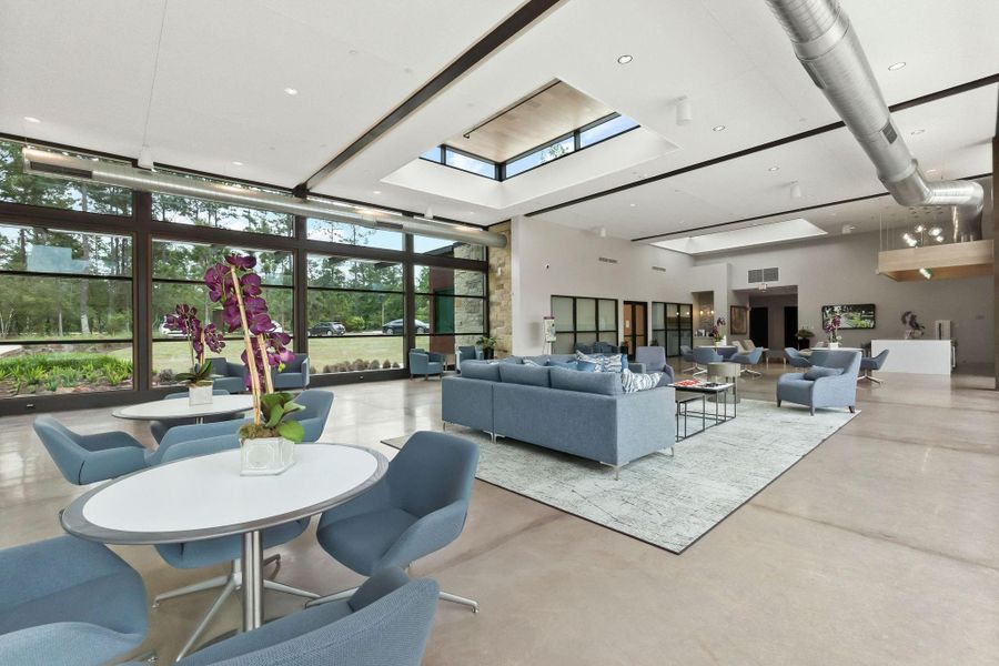 The architecturally stunning clubhouse features clean lines and large windows, housing multipurpose rooms for events, a fitness center, and shaded outdoor seating areas perfect for gathering with neighbors.