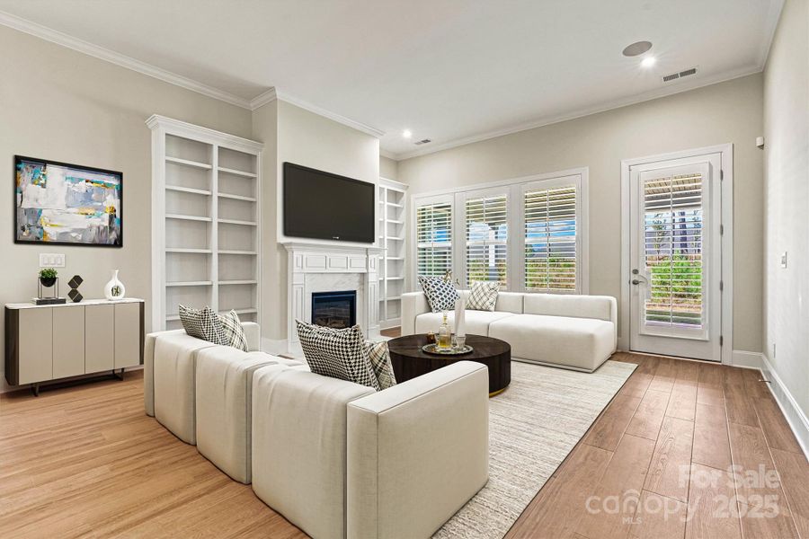 VIRTUALLY STAGED Great Room with custom built-ins, plantation shutters and gorgeous gas fireplace VIRTUALLY STAGED Great Room with custom built-ins, plantation shutters and gorgeous gas fireplace