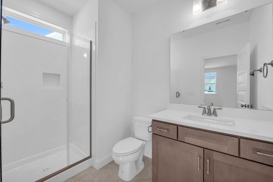 Representative furnished interior of a home built from the The Highland by RobuckHomes in Windwater, Hampstead (Image 19).