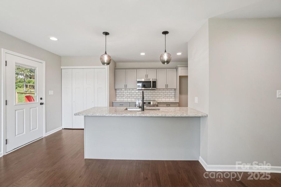 Modern kitchen with seperate entry from covered parking