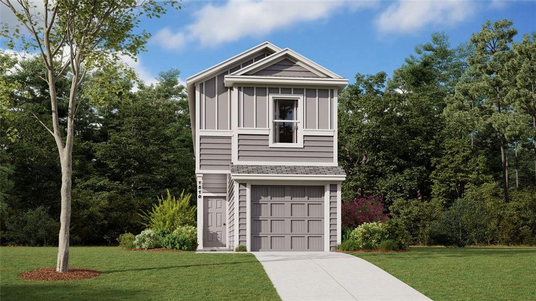 View of front of house featuring a garage and a front yard