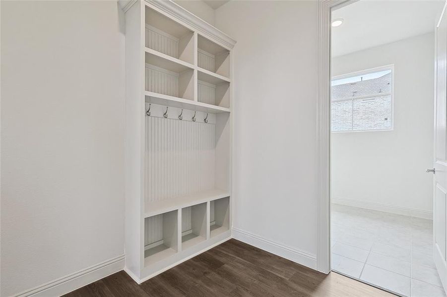 Mudroom with hardwood / wood-style floors