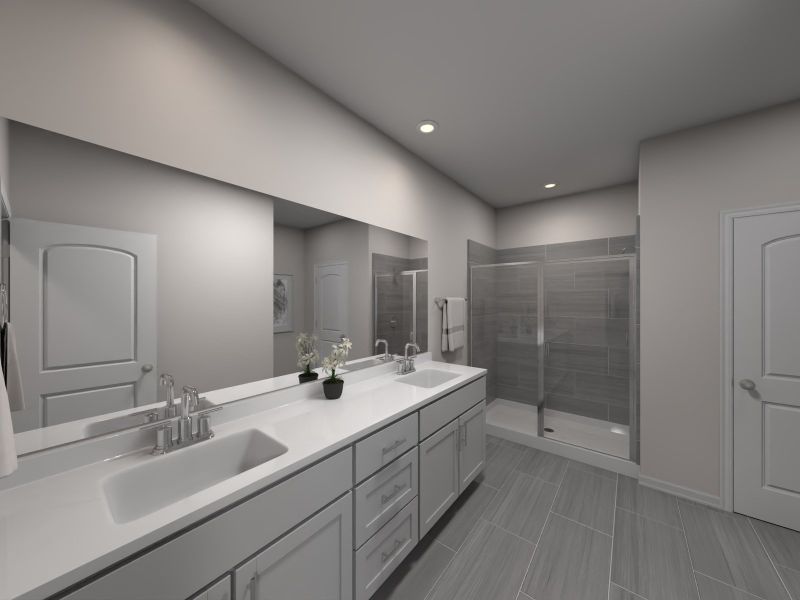 The primary bath offers dual sinks and a walk-in shower.