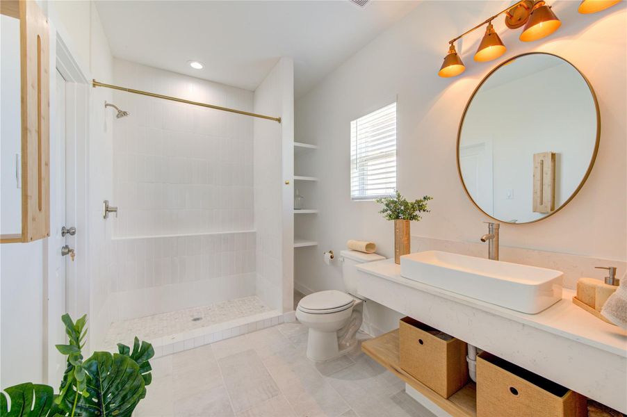 Stylish primary bathroom with modern vanity and quality finishes