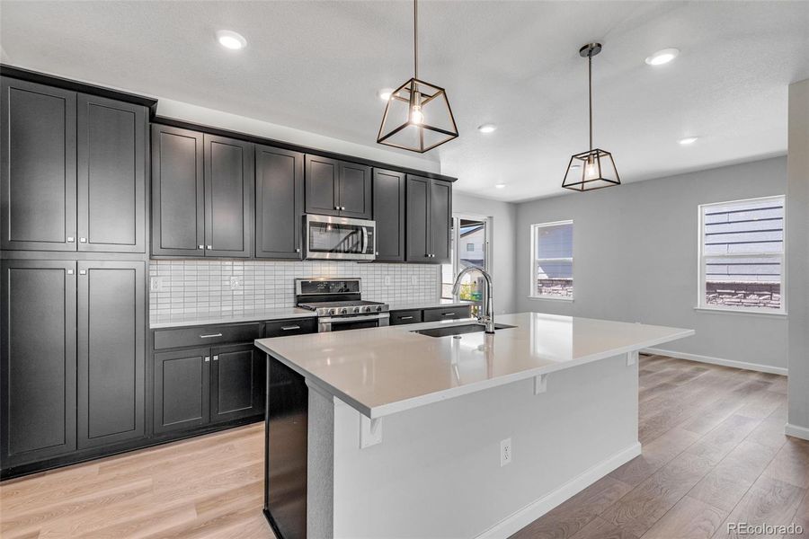 Furnished interior view inside a new home in Crescendo at The Aurora Highlands, Aurora (Image 12).