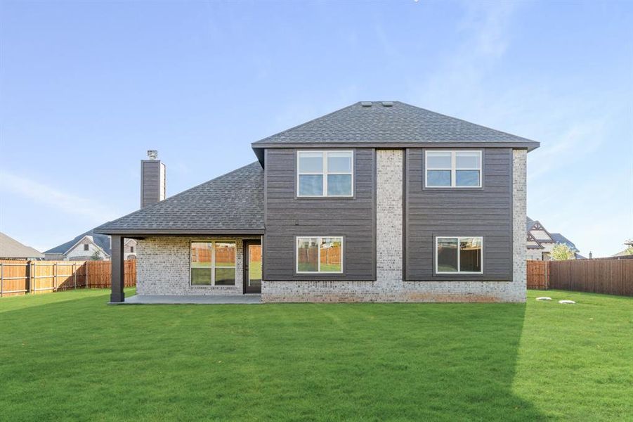 Exterior details and patio area of a home in Coyote Crossing, Godley (Image 23).