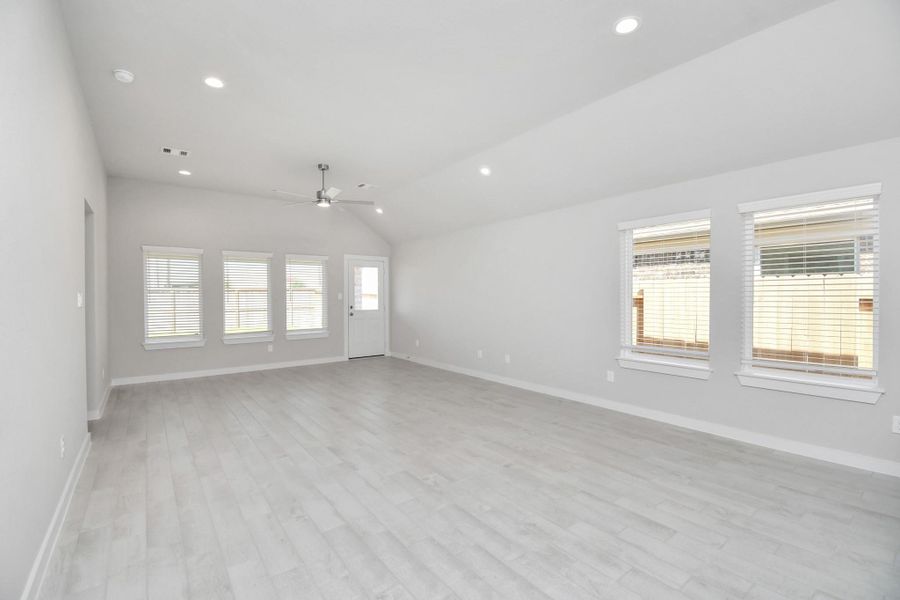 Make memories gathered around the table with your family and friends! This spacious dining room features elegant flooring, custom paint, and adjacent to family room and kitchen for open concept feel. Sample photo of completed home with similar floor plan. Actual colors and selections may vary.