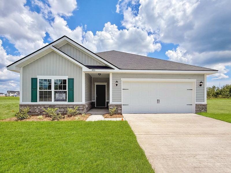 Front exterior of a new home in The Village at Sassafras, Allenhurst, GA, highlighting curb appeal (Image 1). Front exterior of a new home in The Village at Sassafras, Allenhurst, GA, highlighting curb appeal (Image 1).
