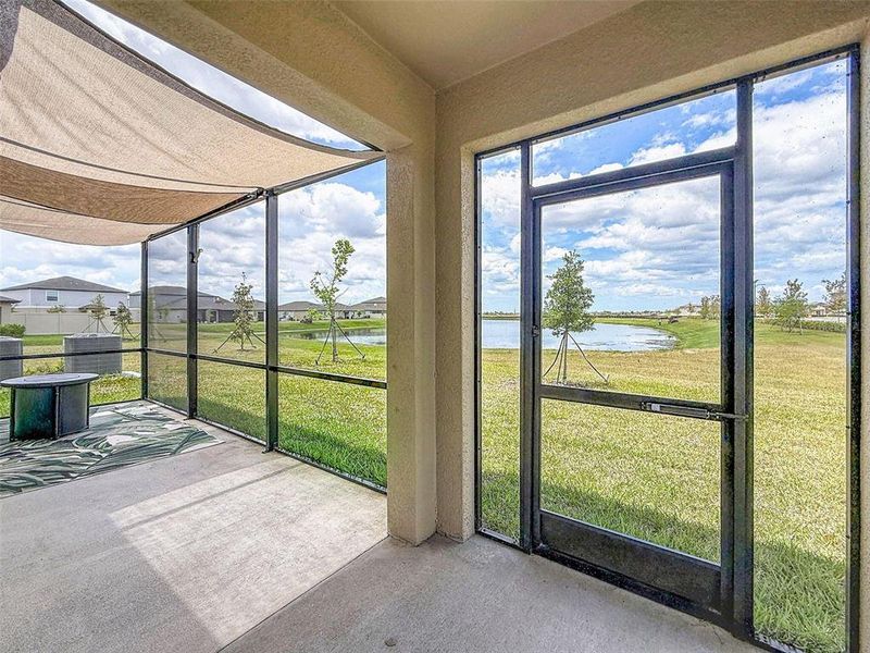 Exterior details and patio area of a home in Prosperity Lakes, Parrish (Image 2).