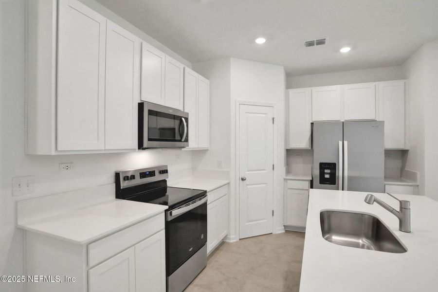 Furnished interior view inside a new home in Atlantis Pointe, Middleburg (Image 13).
