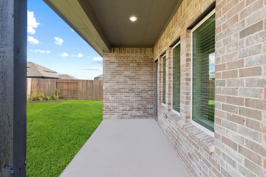 Enjoy peaceful mornings and relaxing evenings on your spacious covered patio! Perfect for grilling, entertaining, or simply unwinding while overlooking your fully sodded backyard. With durable brick construction and a sprinkler system in place, this outdoor retreat is as low-maintenance as it is inviting.