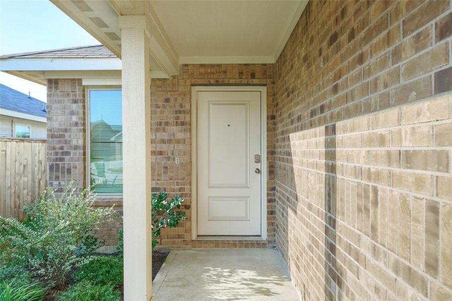 Exterior details and patio area of a home in Tavola: Cottage Collection, New Caney (Image 3).