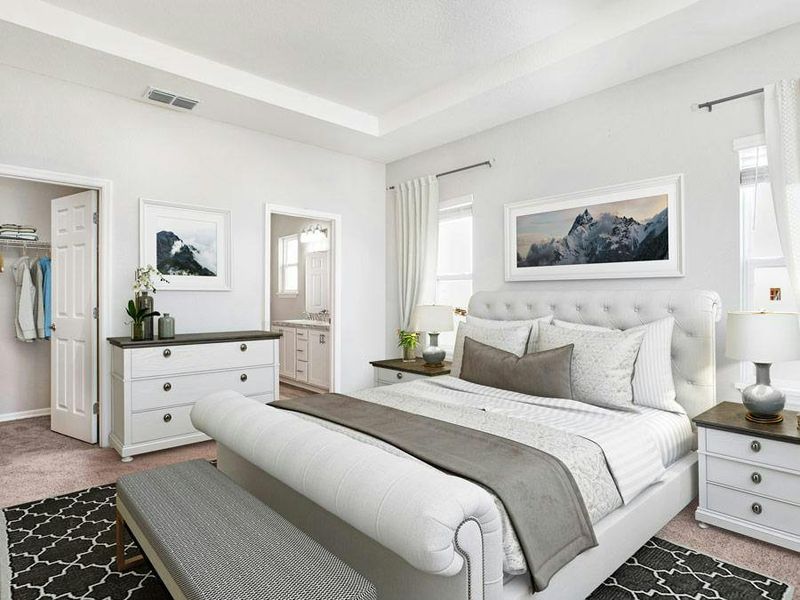 Your spacious owner`s suite includes a tray ceiling, walk-in wardrobe, and lanai access - Savannah by Highland Homes