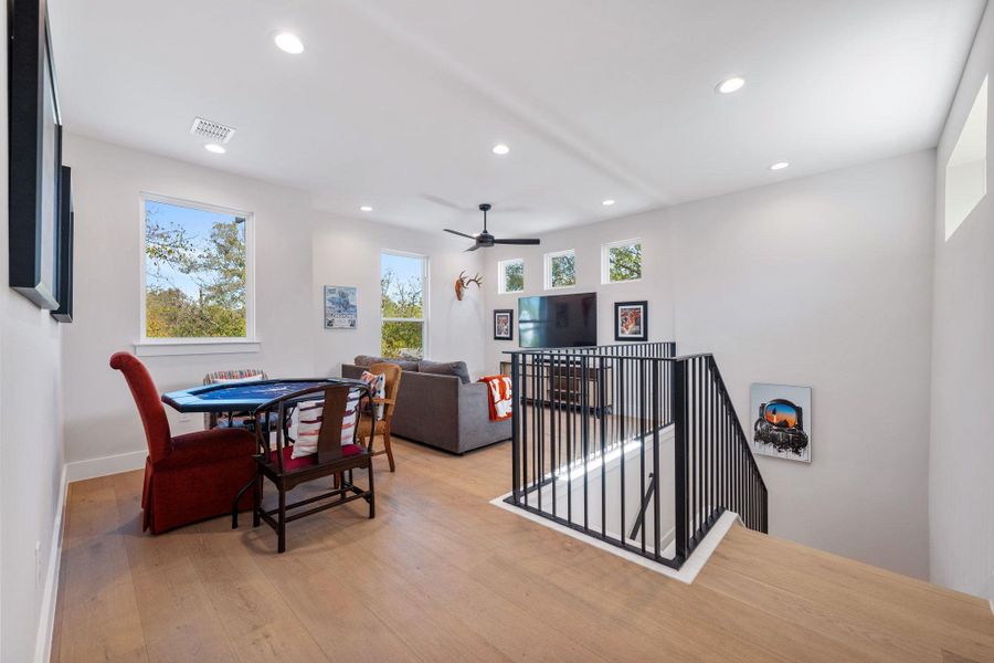 Dining area with recessed lighting, light wood finished floors, and a ceiling fan