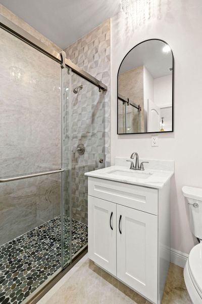 3rd Bathroom with custom glass shower.