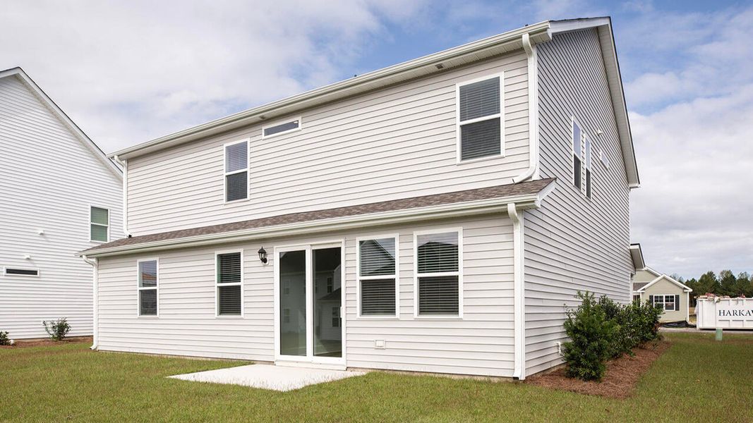Exterior details and patio area of a home in Surfside Landing, Hubert (Image 3).