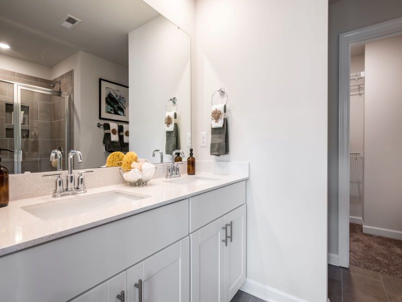 The primary suite boasts a private ensuite with dual sinks and walk-in closet.