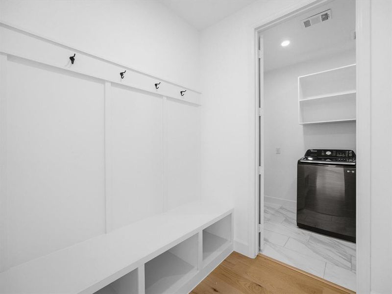 Mudroom with washer / clothes dryer, light wood-style floors, and recessed lighting Mudroom with washer / clothes dryer, light wood-style floors, and recessed lighting