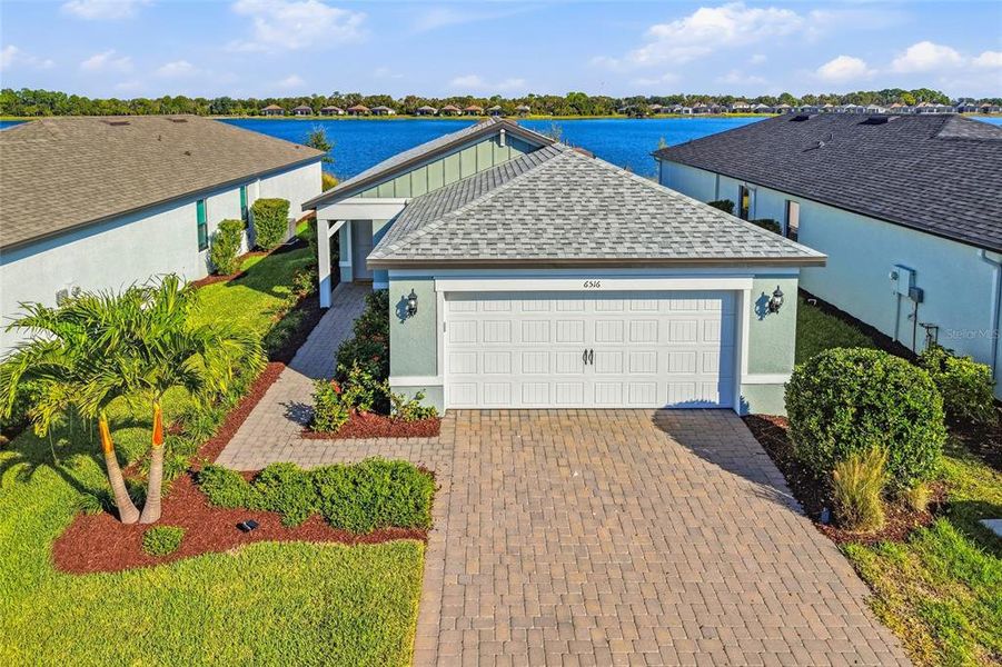 Front exterior of a new home in , Sarasota, FL, highlighting curb appeal (Image 2). Front exterior of a new home in , Sarasota, FL, highlighting curb appeal (Image 2).