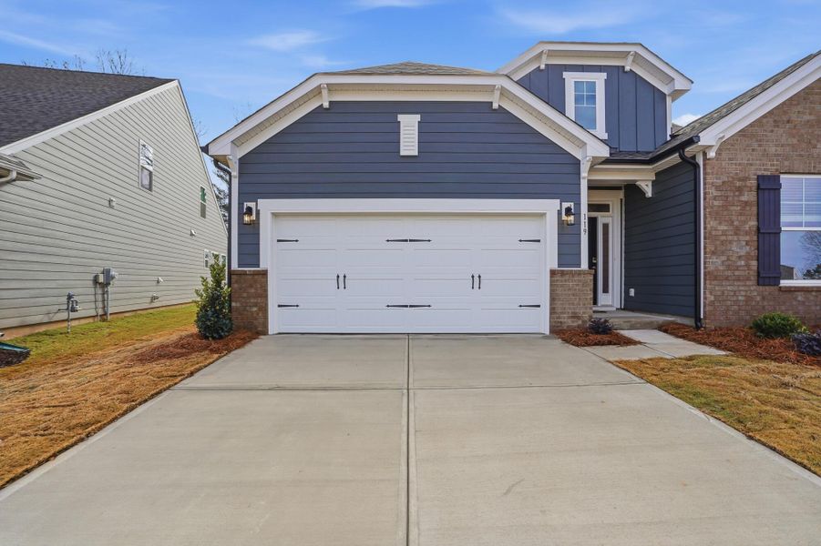 Front exterior of a new home in Villas at Prestwick, Mooresville, NC, highlighting curb appeal (Image 26). Front exterior of a new home in Villas at Prestwick, Mooresville, NC, highlighting curb appeal (Image 26).
