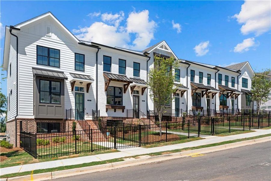 Front exterior of a new home in Palisades Townhomes, Cumming, GA, highlighting curb appeal (Image 20). Front exterior of a new home in Palisades Townhomes, Cumming, GA, highlighting curb appeal (Image 20).