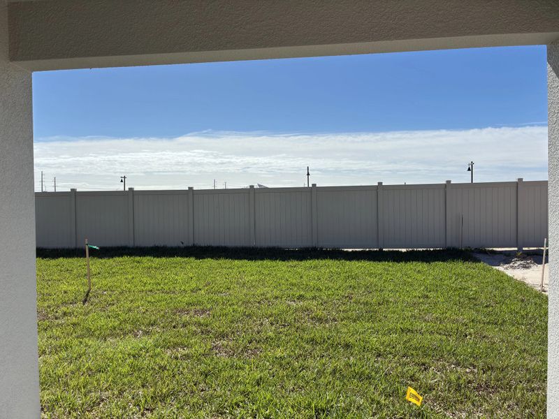 Spacious backyard with privacy fence