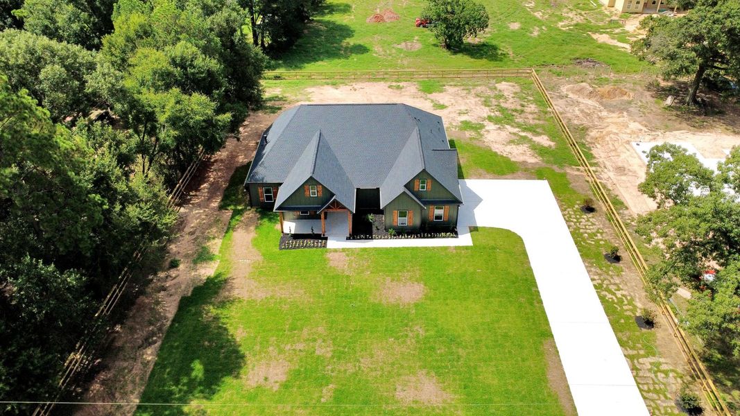 Front exterior of a new home in , Plantersville, TX, highlighting curb appeal (Image 29). Front exterior of a new home in , Plantersville, TX, highlighting curb appeal (Image 29).