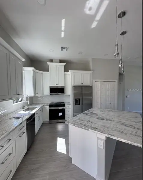 Furnished interior view inside a new home in , Port Charlotte (Image 5). Furnished interior view inside a new home in , Port Charlotte (Image 5).