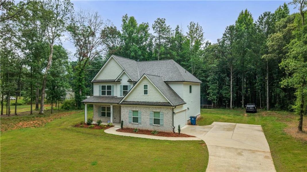 Front exterior of a new home in , McDonough, GA, highlighting curb appeal (Image 29).