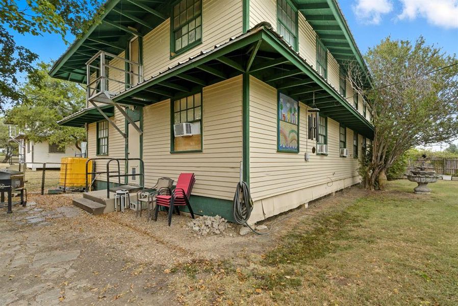 View of side of home with a balcony and cooling unit View of side of home with a balcony and cooling unit