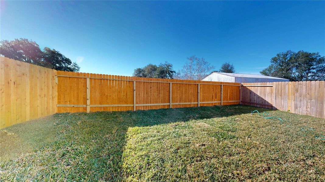 Exterior details and patio area of a home in East Gate Villas, Willis (Image 26).