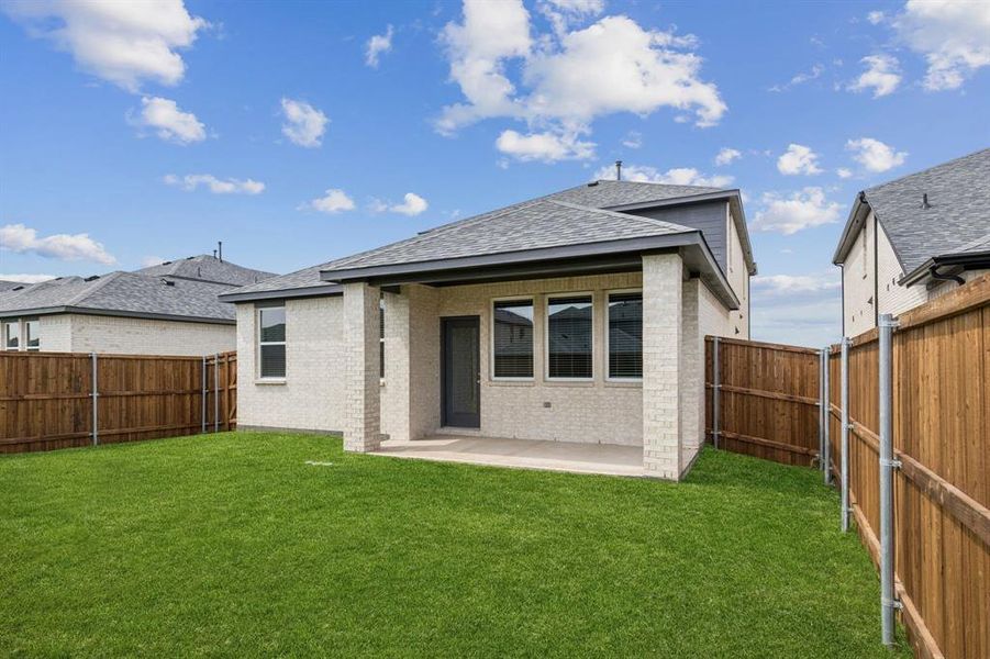 Exterior details and patio area of a home in AnaCapri, Anna (Image 17).