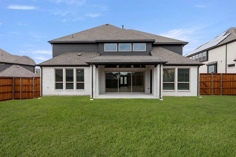 Exterior details and patio area of a home in Cambridge Estates - Harwood, Prosper (Image 4).