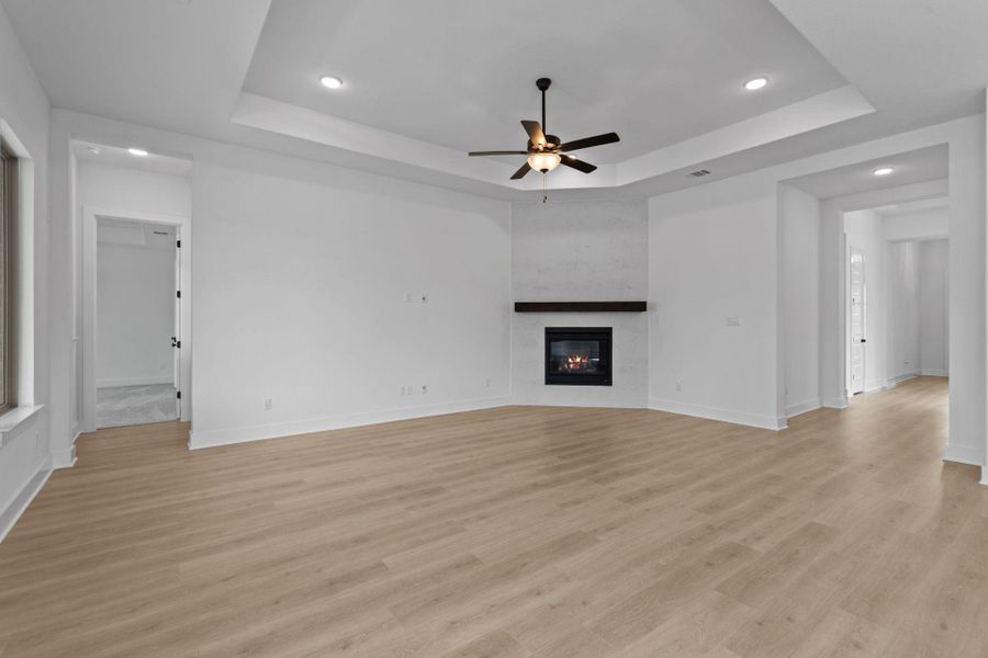 Family Room with tray ceiling & fireplace
