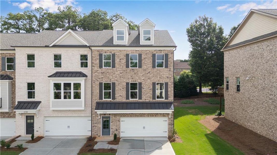 Front exterior of a new home in , Suwanee, GA, highlighting curb appeal (Image 1). Front exterior of a new home in , Suwanee, GA, highlighting curb appeal (Image 1).