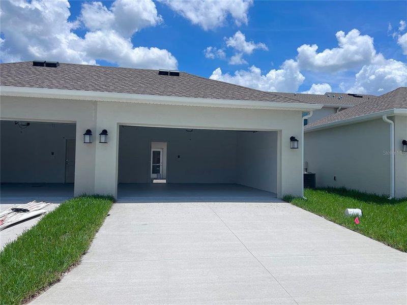 Front exterior of a new home in , Winter Garden, FL, highlighting curb appeal (Image 1). Front exterior of a new home in , Winter Garden, FL, highlighting curb appeal (Image 1).