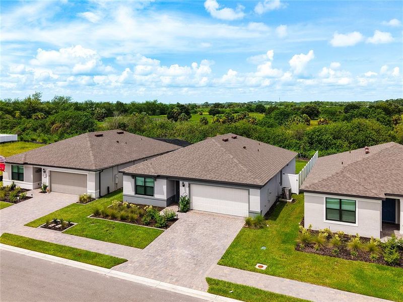 Front exterior of a new home in Caloosa Cove, Labelle, FL, highlighting curb appeal (Image 24).