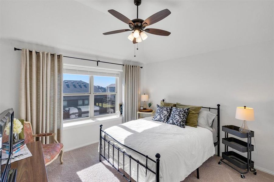 Bedroom with carpet floors and ceiling fan