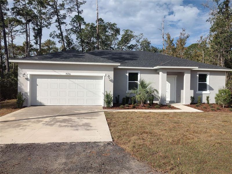 Front exterior of a new home in , Deland, FL, highlighting curb appeal (Image 1). Front exterior of a new home in , Deland, FL, highlighting curb appeal (Image 1).