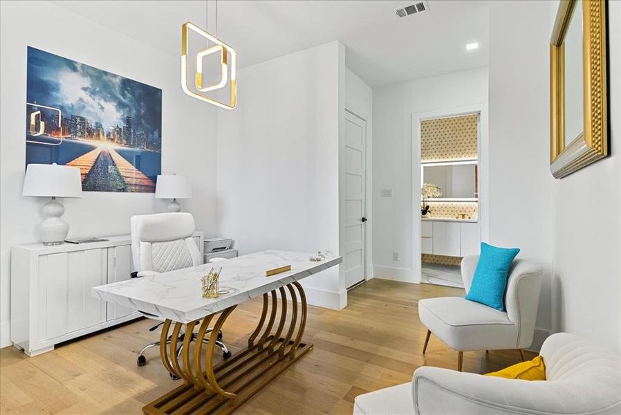 Private Study featuring hardwoods and sitting area