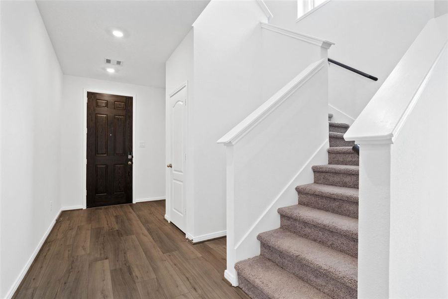 The entryway is bright and spacious while the staircase leads you to the 2nd floor bedrooms and bathrooms. The entryway is bright and spacious while the staircase leads you to the 2nd floor bedrooms and bathrooms.