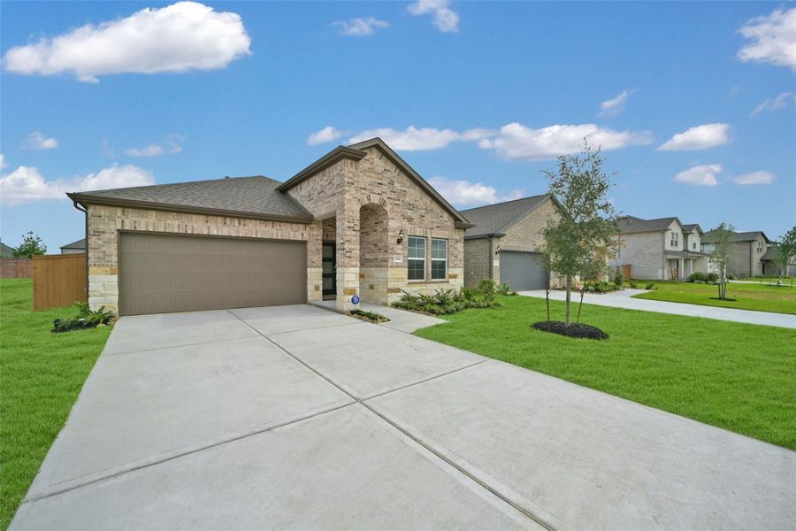 Front exterior of a new home in Sunterra, Katy, TX, highlighting curb appeal (Image 110). Front exterior of a new home in Sunterra, Katy, TX, highlighting curb appeal (Image 110).
