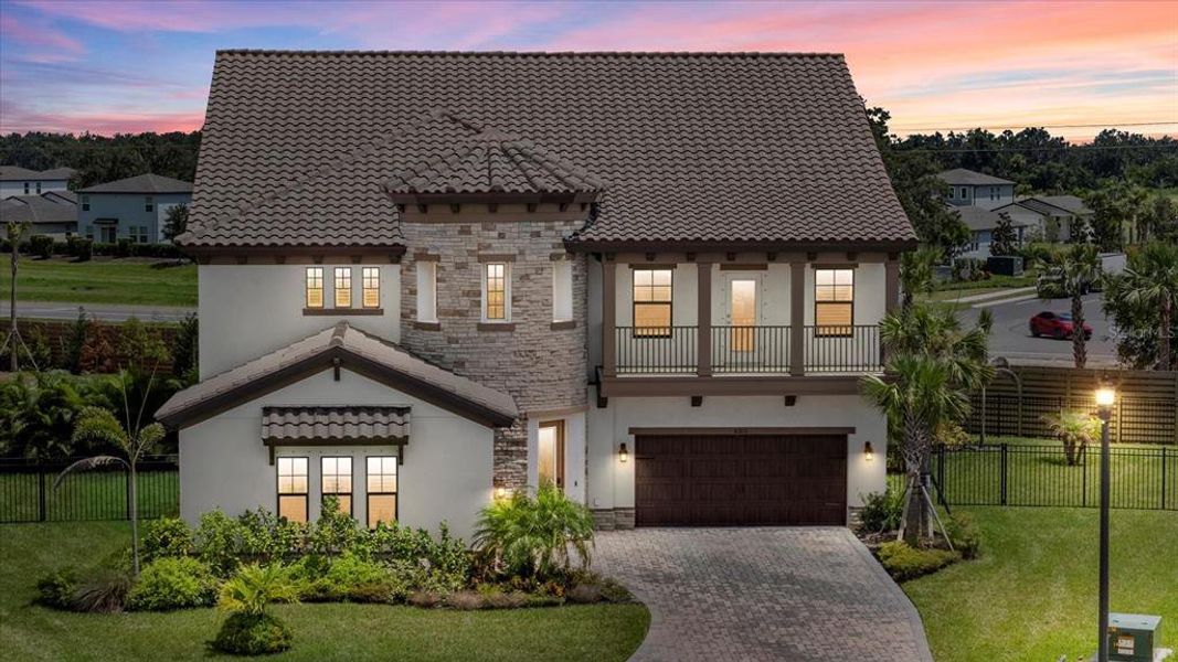 Front exterior of a new home in Crosswind Ranch, Parrish, FL, highlighting curb appeal (Image 27).