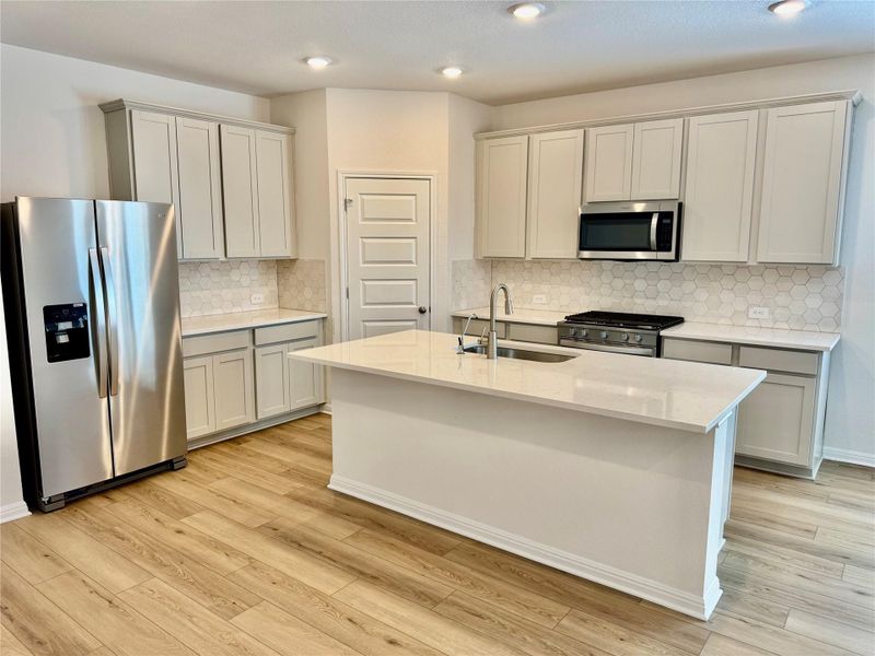 Furnished interior view inside a new home in Riverbend at Double Eagle - Boulevard Collection, Cedar Creek (Image 4).