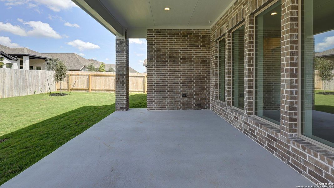 Exterior details and patio area of a home in Kallison Ranch 50', San Antonio (Image 30).